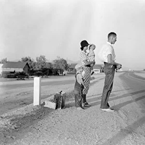 MIGRANT FAMILY, 1936. A migrant family from Oklahoma standing along the highway between Blythe