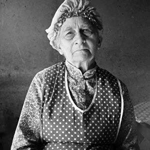 MIGRANT WOMAN, 1939. A grandmother living with her family on a farm in Malheur County, Oregon