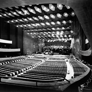 NEW YORK: LINCOLN CENTER. The auditorium of Philharmonic Hall at Lincoln Center, photographed from the loge. On stage, a choir is rehearsing for opening night. Photographed September 1962