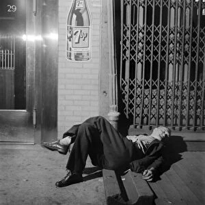 NYC: BOWERY, 1942. A man sleeping on the Bowery in New York City. Photograph by Marjory Collins