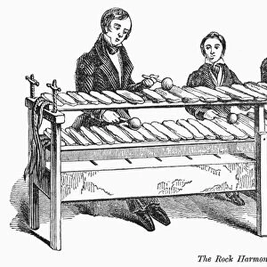 ROCK HARMONICON, 1842. Mallet instrument made from hard slate. Wood engraving, English, 1842