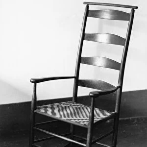 SHAKER ROCKING CHAIR, 1935. A maple Shaker rocking chair with a woven seat at the