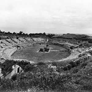 SICILY: AMPHITHEATER. Ruins of the Roman amphitheater at Syracuse, Sicily. Photograph
