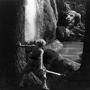 SIEGFRIED SLAYING DRAGON. Siegfried, a Norse and Germanic mythological hero, before slaying the dragon. Still from the film Die Nibelungen, 1924, starring Paul Richter