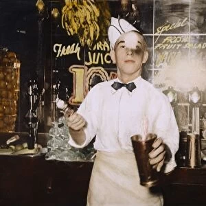 SODA JERK, 1939. A soda jerk at a soda fountain in Corpus Christi, Texas. Oil over a photograph taken, 1939, by Russell Lee