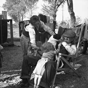 SQUATTER CAMP, 1936. A family in an open air camp near the American River in Sacramento