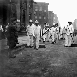 STREET SWEEPERS, 1911. A group of New York City street sweepers photographed at