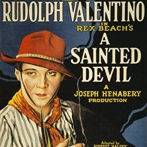 VALENTINO, R. : POSTER, 1924. The cinemactor Rudolph Valentino featured on a poster for the 1924 movie, A Sainted Devil