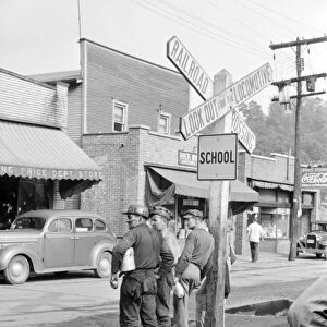 WEST VIRGINIA: BAR, 1938. Coal miners waiting for the bus home in Osage, West Virginia