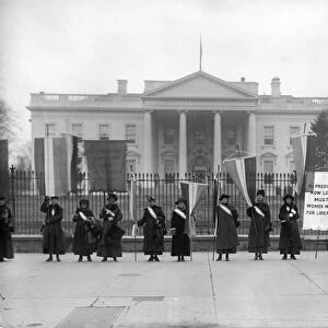 WHITE HOUSE: SUFFRAGETTES. Women suffragettes picketing in front of the White House, Washington, D. C. 1917