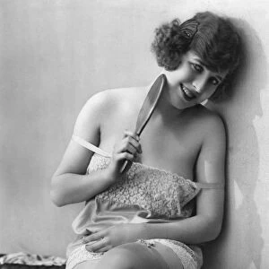 WOMAN, 1920s. A French woman in a nightgown. Photograph, 1920s