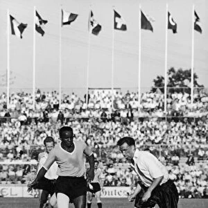 WORLD CUP, 1954. Victor Rodriguez Andrade of Uruguay (left) and Nathaniel Lofthouse of England face off during the 1954 World Cup in Switzerland