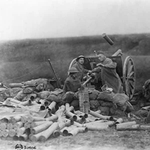 WORLD WAR I: ARTILLERY, c1917. Artillery shell being discharged from a heavy gun