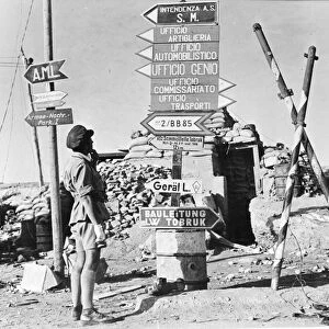 WORLD WAR II: LIBYA, c1942. Signposts printed in German and Italian point to former
