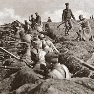 WWI: SERBIAN TRENCH. Serbian riflemen in a trench on a hill during World War I
