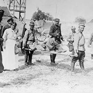 WWI: WOUNDED SOLDIER. A wounded Moroccan soldier on a stretcher. Photograph, c1914