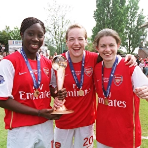 Anita Asante, Gemma Davison and Karen Carney (Arsenal) with the European Trophy
