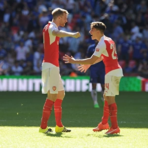 Arsenal Celebrate Community Shield Victory: Mertesacker and Bellerin Embrace in Triumph over Chelsea
