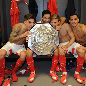 Arsenal Celebrate FA Community Shield Victory over Chelsea (2015-16): Hector Bellerin, Mikel Arteta, Nacho Monreal, and Santi Cazorla Rejoice