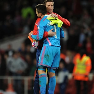 Arsenal Goalkeepers Szczesny and Fabianski Embrace Post-Match: A Moment of Sportsmanship between Rivals (Arsenal vs Swansea City, Premier League 2014/15)