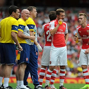 Arsenal Medical Team Tending to Calum Chambers and Aaron Ramsey during Arsenal v Benfica, Emirates Cup 2014-15