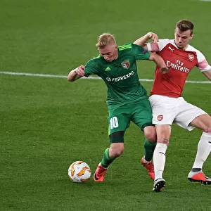Arsenal vs Vorskla Poltava: Rob Holding Tackles Vladyslav Kulach in Europa League Clash