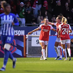 Arsenal Women's Team Celebrates Caitlin Foord's Goal Against Brighton & Hove Albion in Barclays WSL (2023-24)