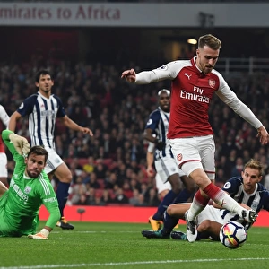 Arsenal's Aaron Ramsey Faces Off Against West Bromwich Albion's Ben Foster