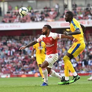 Arsenal's Alexandre Lacazette Faces Off Against Cheikhou Kouyate in Intense Arsenal v Crystal Palace Clash