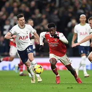 Arsenal's Eddie Nketiah Clashes with Tottenham's Lenglet and Dier in Premier League Showdown