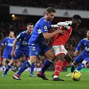 Arsenal's Eddie Nketiah Faces Off Against Everton's James Tarkowski in Premier League Clash