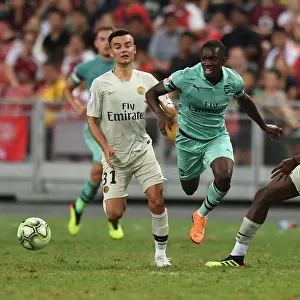 Arsenal's Eddie Nketiah Goes Head-to-Head with Moussa Sissako and Alec Georgen of Paris Saint-Germain in Intense 2018 Pre-Season Clash