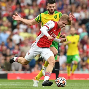 Arsenal's Emile Smith Rowe Clashes with Norwich's Grant Hanley in Premier League Showdown