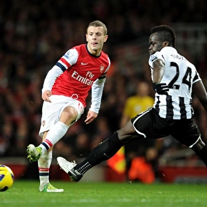 Arsenal's Jack Wilshere Fends Off Newcastle's Cheick Tiote: A Battle in the Midfield, December 2012