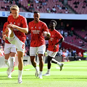 Arsenal's Martin Odegaard Prepares for Battle: Arsenal vs Manchester United, Premier League 2023-24, Emirates Stadium