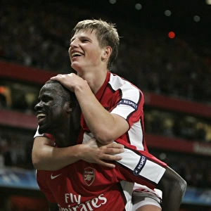 Arshavin and Eboue: Celebrating Arsenal's 2-0 Victory Over Olympiacos in the Champions League