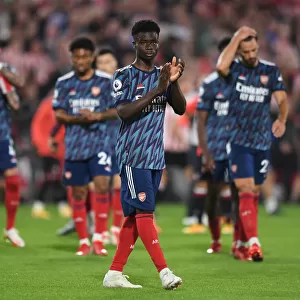 Bukayo Saka Celebrates with Arsenal Fans after Brentford Victory - 2021-22 Premier League