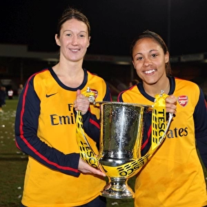 Ciara Grant and Alex Scott (Arsenal) with the league cup trophy