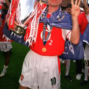 Dennis Bergkamp (Arsenal) with the Premiership trophy