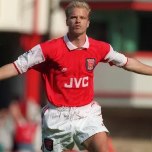 Dennis Bergkamp celebrates scoring his first goal for Arsenal