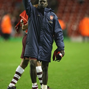 Emmanuel Eboue waves to the Arsenal fans after the match