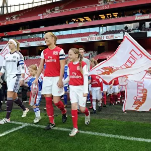 Katie Chapman (Arsenal Ladies) and Carly Telford (Chelsea) lead out their teams