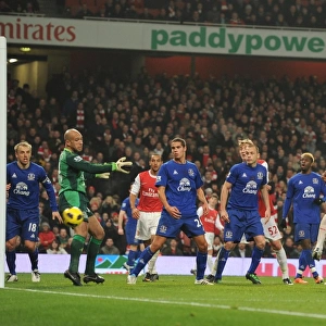 Laurent Koscielny heads past Everton goalkeeper Tim Howard to score the 2nd Arsenal goal