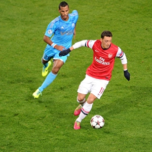 Mesut Ozil vs. Alaixys Romao: A Football Rivalry Ignites in the Arsenal vs. Marseille UEFA Champions League Clash, 2013