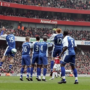 Robin van Persie (Arsenal) watches his free kick beat the wall but go wide of the goal