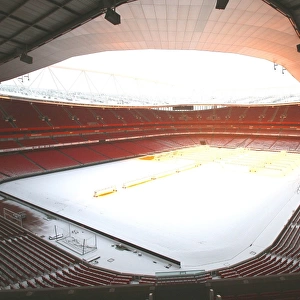 Winter's Embrace: Arsenal's Snow-Covered Emirates Stadium