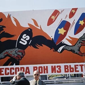 Aggressors out of vietnam! reads a cold war era billboard on a moscow street showing bombs raining down on uncle sam (usa), may 1, 1968