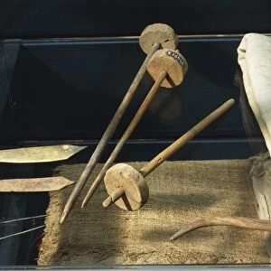 Ancient Egyptian tools used for textile manufacturing: spatulas, bronze needles, wooden spindles from Deir el-Medina, New Kingdom, XIX-XX Dynasty