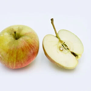 Apple Cevaal, whole and half, close-up