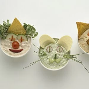 Bowls containing food made in to the shape of faces